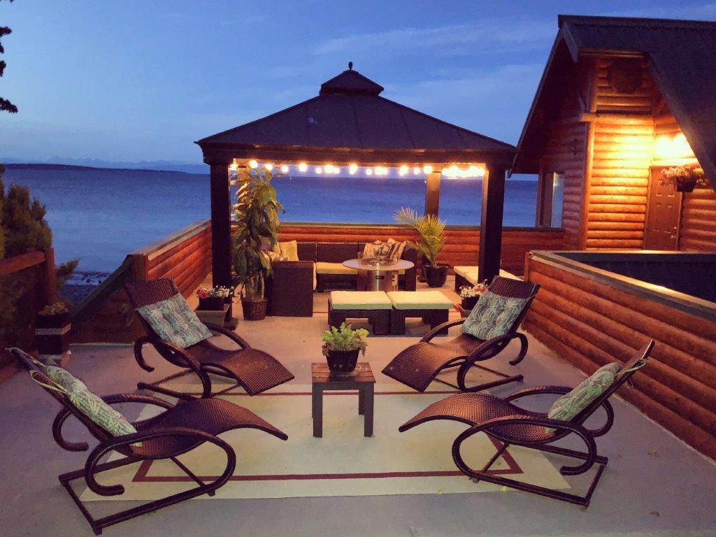Upper Deck & Fire Pit Seating at Qualicum Breeze Beach House at Night